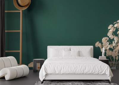 Copy space on the empty green wall of elegant room with wooden ladder with wicker hat and bench Wall mural