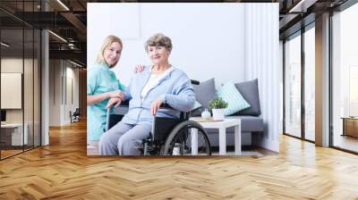 Elderly woman and caregiver Wall mural