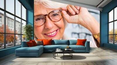 Elegant grandmother in glasses Wall mural