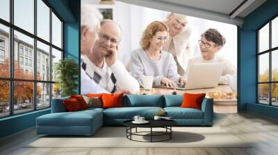 Group of seniors sitting at table Wall mural