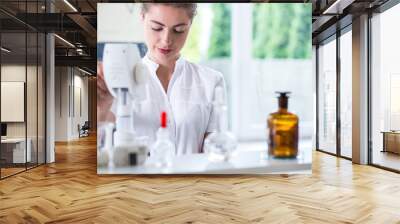 Lab technician doing chemistry experiment Wall mural