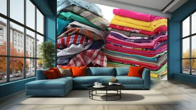 Pile of messy and ironed clothes Wall mural