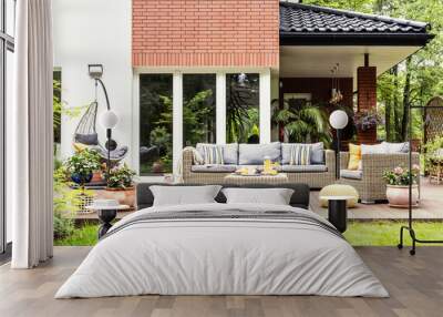 real photo of a beautiful terrace with garden furniture, plants and swing Wall mural