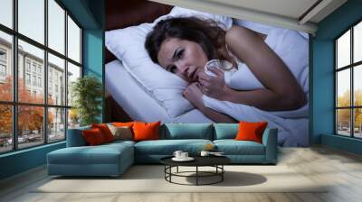 Scared woman trying to sleep Wall mural