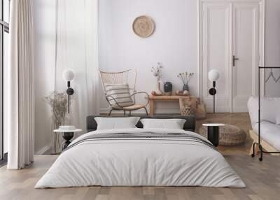 Sheer white curtains on the window of a white living room interior with a striped, linen pillow on a modern wicker chair Wall mural