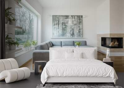 spacious white living room interior with grey corner couch, big modern art painting and fireplace Wall mural