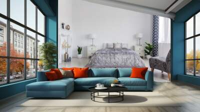 Trendy armchair in bedroom designed in new york style, real photo with copy space Wall mural