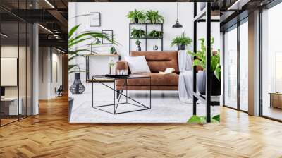 Urban jungle in modern living room interior with big comfortable leather couch and coffee table. Wall mural