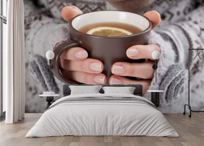 Woman hands with hot drink Wall mural