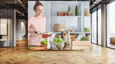 Woman preparing vegetarian meal Wall mural