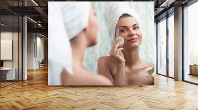 Woman removing make up Wall mural