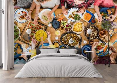 Woman shares tasty meal Wall mural