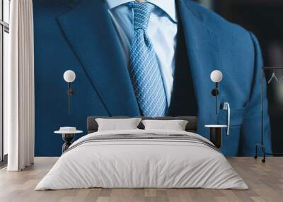 man in blue suit with pen in pocket Wall mural