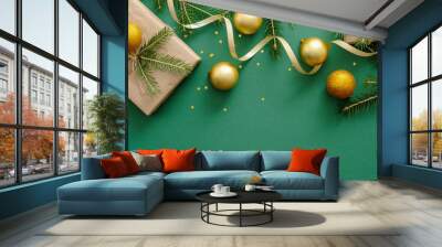 Christmas flatlay composition with Christmas balls, presents, fir tree branches, decoration on green background. Flat lay, top view, overhead. Xmas or New year concept. Banner template with copy space Wall mural