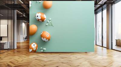 Happy Easter card design. Easter eggs decorated with flowers on pastel green background. Flat lay, top view. Wall mural