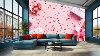 Happy Valentines Day concept. Flat lay composition with gift boxes, confetti, festive decorations on pink background. Wall mural