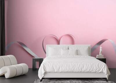 Heart shape border made of silver ribbon on pink background. Greeting card mockup for Valentine's Day or birthday, Mother's day. Love concept. Flat lay, top view. Wall mural