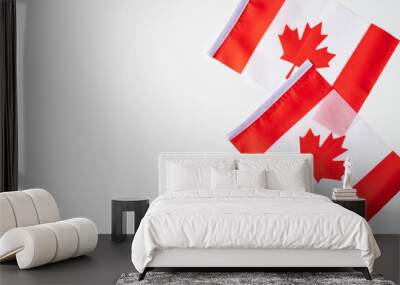 National flags of Canada on white background. Happy Canada Independence Day greeting card template. Flat lay, top view, copy space. Wall mural