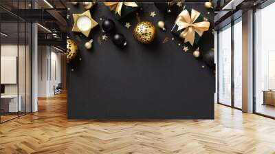 Stylish dark Christmas background with black and gold Xmas decorations, baubles, gift boxes, confetti. Flat lay, top view. Wall mural