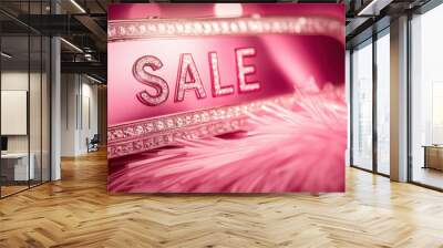 Pink decorative sale sign with rhinestones on furry surface in glamorous retro style. Soft bokeh background. Concept of fashion beauty, visual promotions and advertising Wall mural