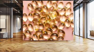 D3 K2 capsules on a pink background. Healthy life concept. Wall mural