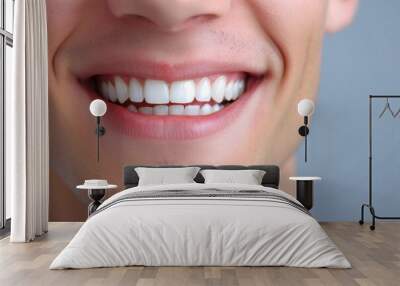 Close-up of a bright smiling European young man showing off healthy white teeth Wall mural