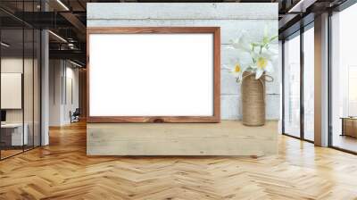 Horizontal A4 Old Wooden Frame mockup near a bouquet of lilies stands on a wooden table on a painted white wooden background. Rustic style, simple beauty. 3d render. Wall mural