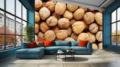 Top view of whole walnuts as background texture Wall mural