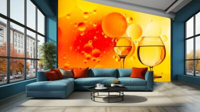 transparent glasses with water and oily drops on colorful background Wall mural