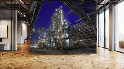 view of metal pipes of illuminated industrial plant outdoor at night  Wall mural