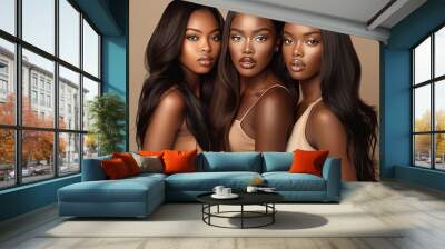 Three beautiful black women model with long hair extensions, beauty concept, beige background Wall mural