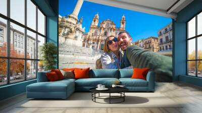 happy tourist couple taking selfie in Palermo in the San Domenico church in Palermo square, Sicily, Italy Wall mural