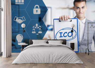 Business, technology, internet and network concept. Young businessman shows a keyword: ICO Wall mural