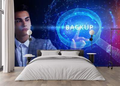 Business, Technology, Internet and network concept. Young businessman working on a virtual screen of the future and sees the inscription: Backup Wall mural