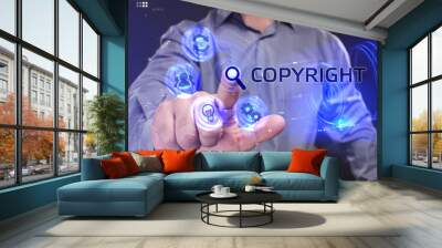 Business, Technology, Internet and network concept. Young businessman working on a virtual screen of the future and sees the inscription: Copyright Wall mural