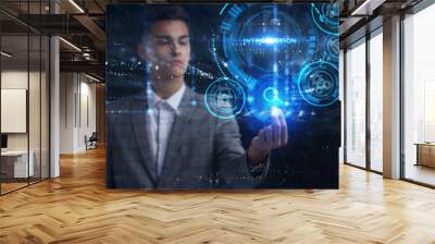 Business, Technology, Internet and network concept. Young businessman working on a virtual screen of the future and sees the inscription: Introduction Wall mural