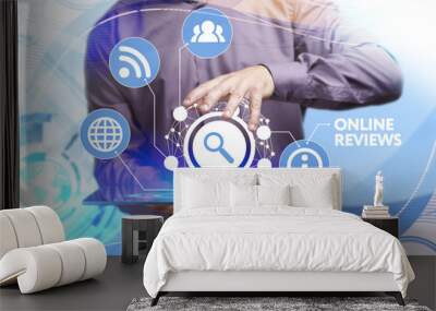 Business, Technology, Internet and network concept. Young businessman working on a virtual screen of the future and sees the inscription: Online reviews Wall mural