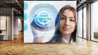 Business, Technology, Internet and network concept. Young businessman working on a virtual screen of the future and sees the inscription: Video marketing Wall mural