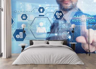 Planning marketing strategy. Business, Technology, Internet and network concept. Young businessman shows the word: Marketing automation Wall mural