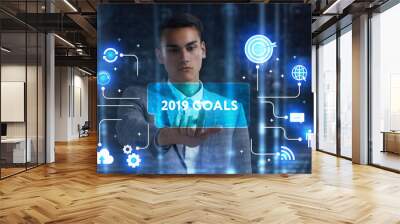 The concept of business, technology, the Internet and the network. A young entrepreneur working on a virtual screen of the future and sees the inscription: 2019 goals Wall mural