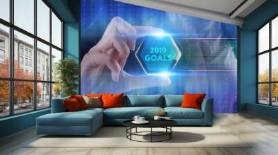 The concept of business, technology, the Internet and the network. A young entrepreneur working on a virtual screen of the future and sees the inscription: 2019 goals Wall mural