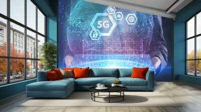 The concept of business, technology, the Internet and the network. A young entrepreneur working on a virtual screen of the future and sees the inscription: 5G Wall mural