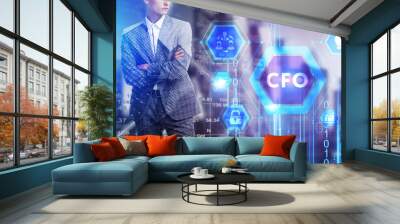 The concept of business, technology, the Internet and the network. A young entrepreneur working on a virtual screen of the future and sees the inscription: CFO Wall mural