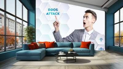 The concept of business, technology, the Internet and the network. A young entrepreneur working on a virtual screen of the future and sees the inscription: Ddos attack Wall mural