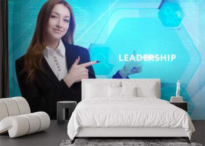 The concept of business, technology, the Internet and the network. A young entrepreneur working on a virtual screen of the future and sees the inscription: Leadership Wall mural