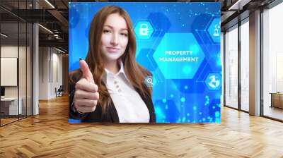 The concept of business, technology, the Internet and the network. A young entrepreneur working on a virtual screen of the future and sees the inscription: Property management Wall mural