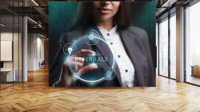 The concept of business, technology, the Internet and the network. A young entrepreneur working on a virtual screen of the future and sees the inscription: Referrals Wall mural