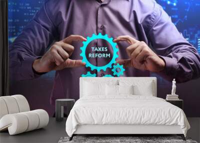 The concept of business, technology, the Internet and the network. A young entrepreneur working on a virtual screen of the future and sees the inscription: taxes reform Wall mural