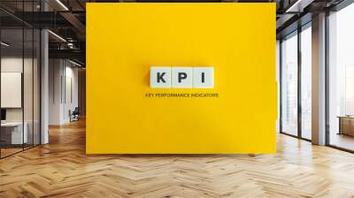 Key Performance Indicators (KPI) Concept and Banner. Marketing Metrics and Measurement. Block letters on bright yellow orange background. Minimal aesthetics. Wall mural