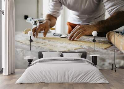 Making ravioli on a wooden table and tools Wall mural